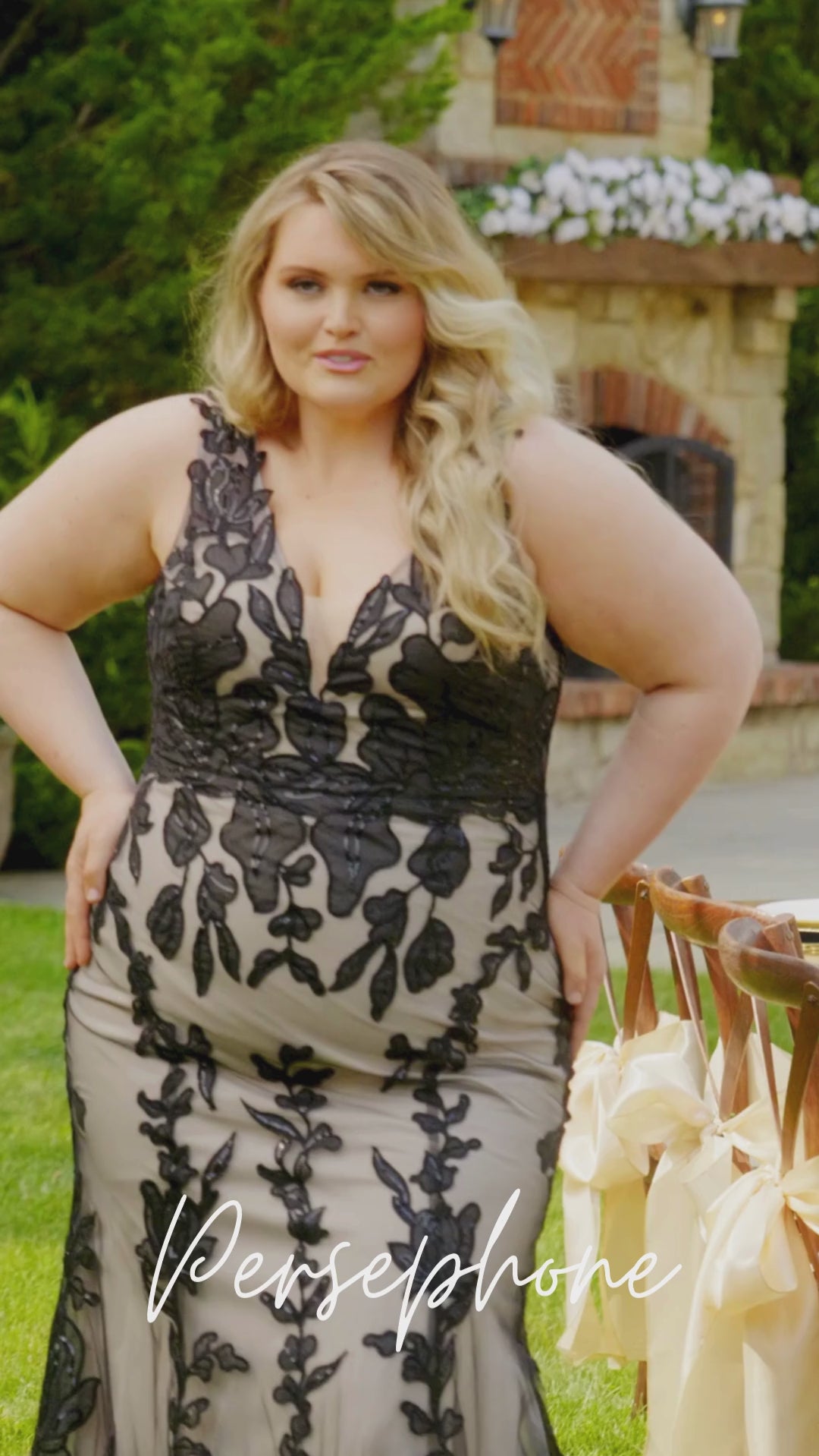 Plus-size bride modeling the MB2606 wedding gown by Michelle Bridal, showcasing a supportive bodice and elegant flowing silhouette designed for curvy brides.