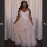 Michelle Bridal Style MB2301 available in sand or ivory. Plus size A-line wedding gown with modern leaf lace, decorative straps on the back bodice and long train. Only sold in stores. 