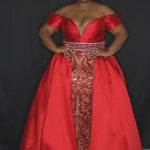 Johnathan Kayne for Sydney's Closet slim fitted silhouette with plunging sweetheart neckline and mikado hostess overskirt and off the shoulder cuff available in powder blue and scarlet Avalon Pageant Gown JK2213