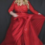 Johnathan Kayne for Sydney's Closet jumpsuit with v neckline and detatchable charmeuse overskirt and long sleeves made of stretch sequin fabric available in firecracker and jet Matador Pageant Jumpsuit JK2220