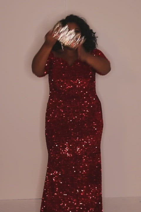 Johnathan Kayne for Sydney's Closet slim fitted silhouette with half sleeves and made with velvet sequin fabric available in cherry and indigo Spark Evening Gown JK2208Best seller! Johnathan Kayne for Sydney's Closet plus size pageant, prom, evening, mother of the bride or groom formal gown.  Off-the-shoulder sleeves and fitted silhouette made in vibrant stretch sequins. Style JK2208