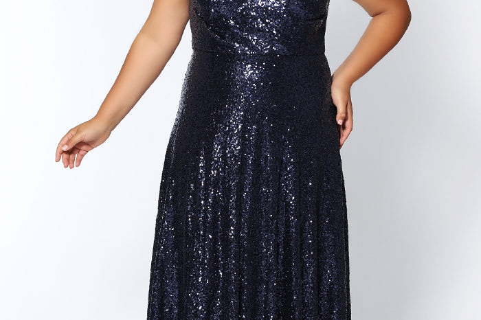 CE1801 in navy, black or rose gold is a floor length sequin gown with bra-friendly straps and a V-neckline. Sydney's Closet plus size sequin dress