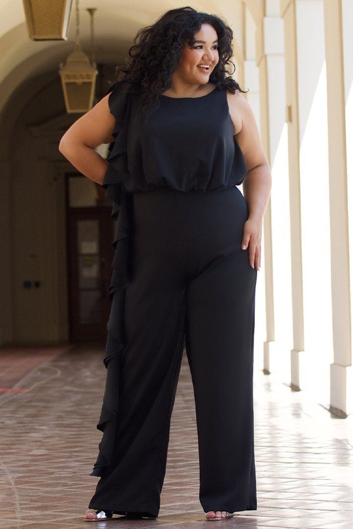 CE2014 by Sydney's Closet french crepe fabric jumpsuit with flounce on side of bodice and pant with center back zipper and scoop neckline, bra friendly straps and sleeveless available in red, black and ivory.