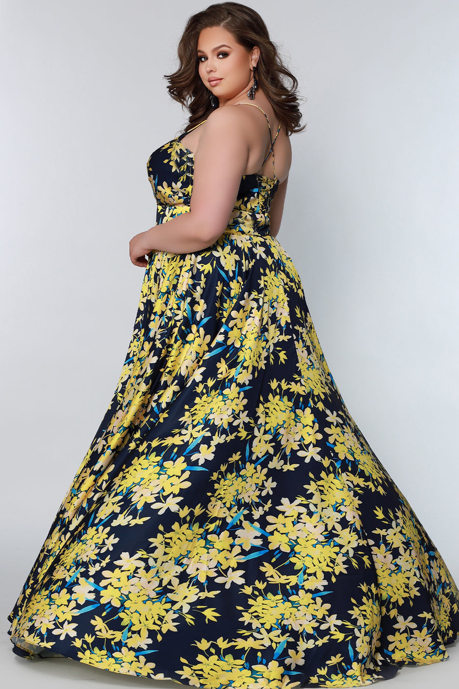 CE2206 Celebrations by Sydney's Closet aline silhouette with sweetheart neckline and spaghetti straps dress features zipper back with leg slit and pockets available in pink blossom and yellow blossom