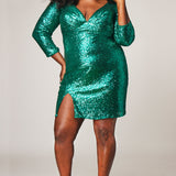CE2303 Celebrations by Sydney's Closet plus size short sequin party dress, cocktail dress, wedding guest dress. Long sleeves, deep V-neckline, ruched bodice and slit.  Available in rose gold, raven baclk, ruby red, sapphire blue and emerald green. Photographer Lindsay Adler