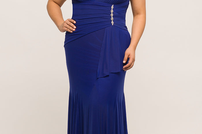 JK2004 stretch knit plus size evening gown in black, burgundy, or royal.  Deep V-bodice, small cap sleeve, flattering pleated waistline, fit and flare stretch knit skirt with sweep train. Johnathan Kayne for Sydney's Closet