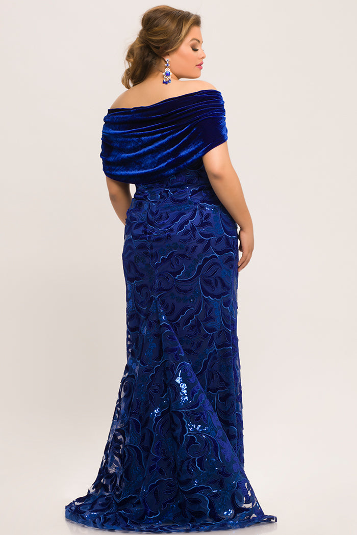 JK2005 royal blue velvet and embellished tulle mermaid plus size evening gown. Semi-sweetheart neckline, detachable velvet wrap, floor length fit and flare skirt with sweep train.