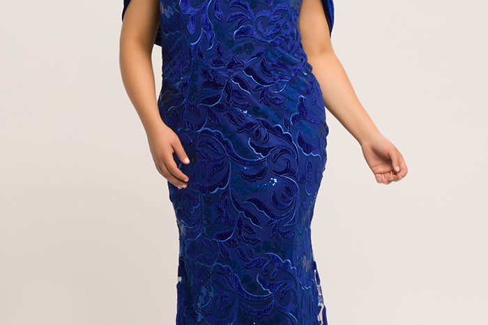 JK2005 royal blue velvet and embellished tulle mermaid plus size evening gown. Semi-sweetheart neckline, detachable velvet wrap, floor length fit and flare skirt with sweep train.