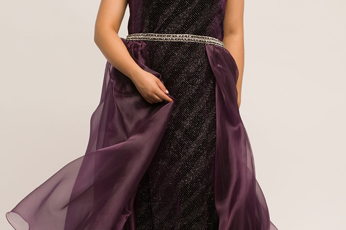 JK2017 deep purple plus size evening gown with strapless sweetheart bodice, beaded waistline, velvet sheath silhouette with embellished silver design. Attached organza fly-away skirt overlay with sweep train.