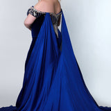 Johnathan Kayne for Sydney's Closet fitted silhouette sweetheart neckline with cape and skirt slit made with stretch velvet available in royal and onyx Jaguar Pageant Gown JK2202