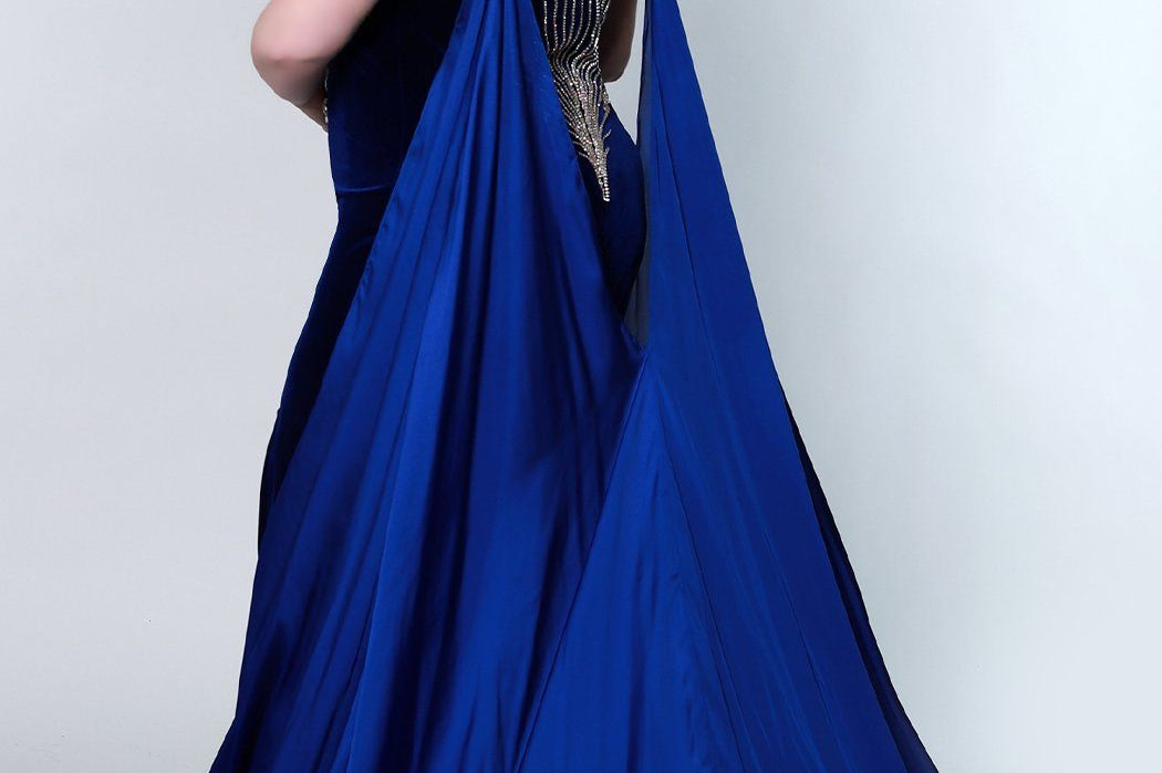 Johnathan Kayne for Sydney's Closet fitted silhouette sweetheart neckline with cape and skirt slit made with stretch velvet available in royal and onyx Jaguar Pageant Gown JK2202