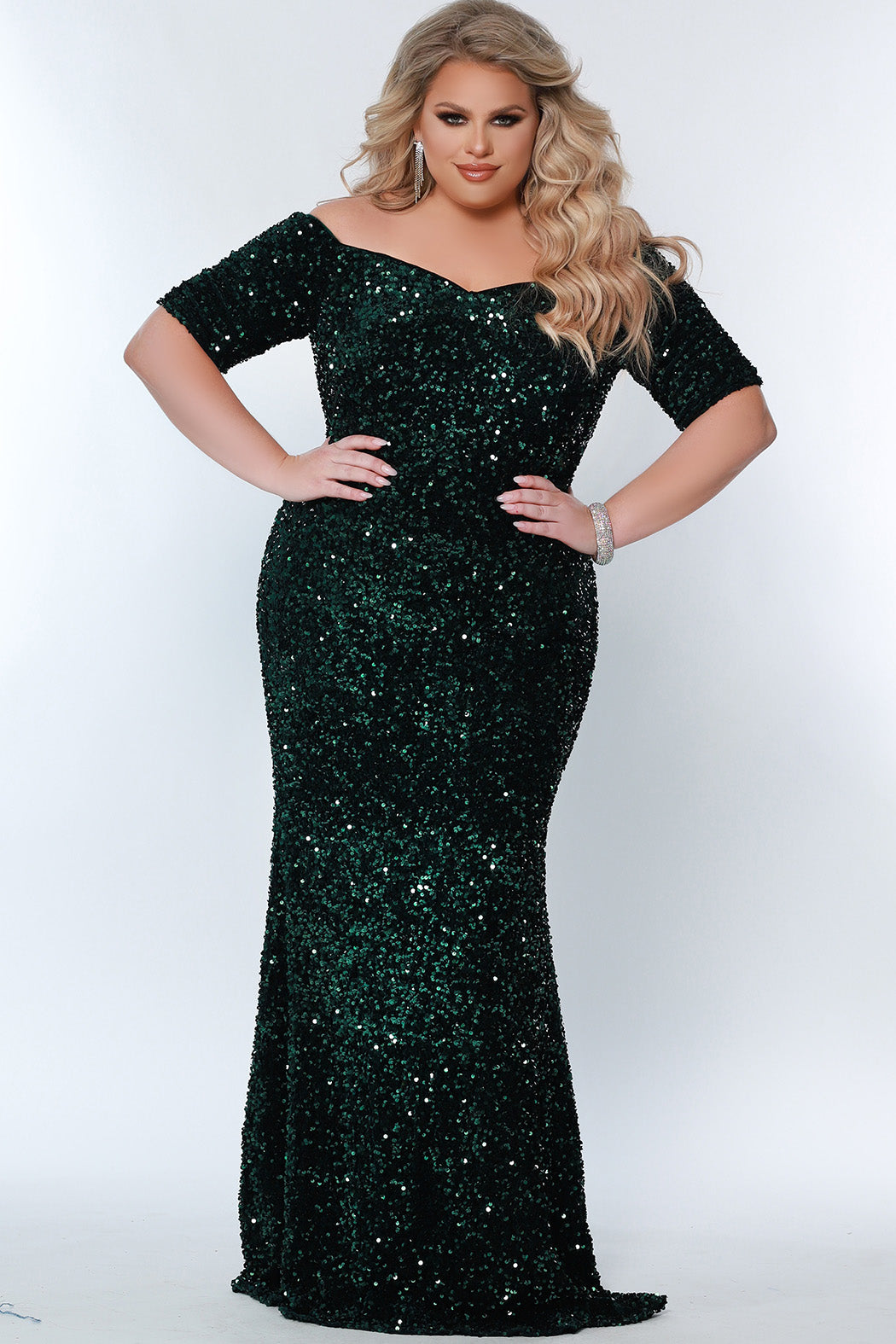 Best seller! Johnathan Kayne for Sydney's Closet plus size pageant, prom, evening, mother of the bride or groom formal gown.  Off-the-shoulder sleeves and fitted silhouette made in vibrant stretch sequins. Style JK2208