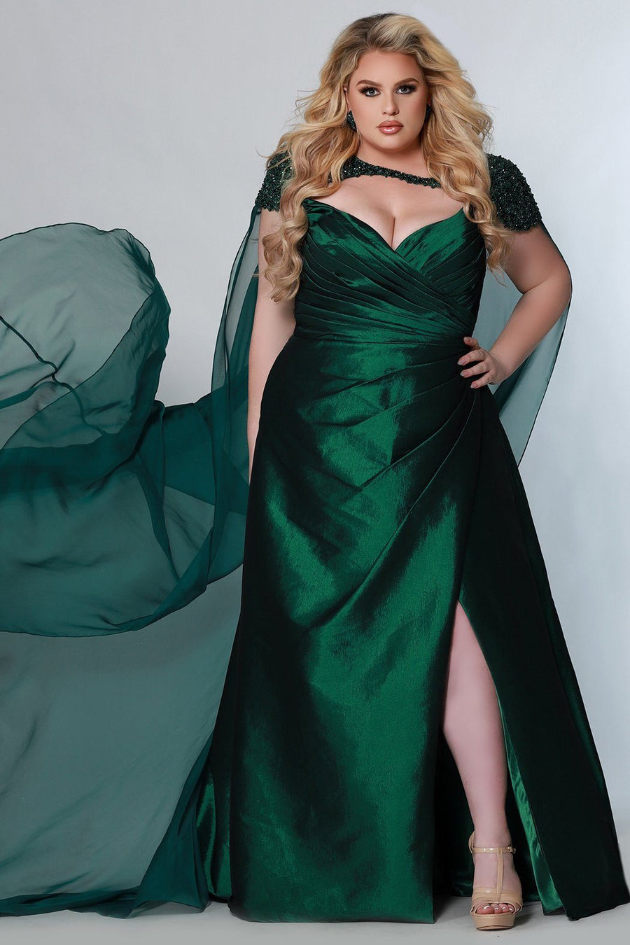 Johnathan Kayne for Sydney's Closet ballgown silhouette with wide slanted pleated skirt with wrpa and leg slit and optional spaghetti straps for strapless bodice available in emerald and fuchsia Lemans Pageant Gown JK2214