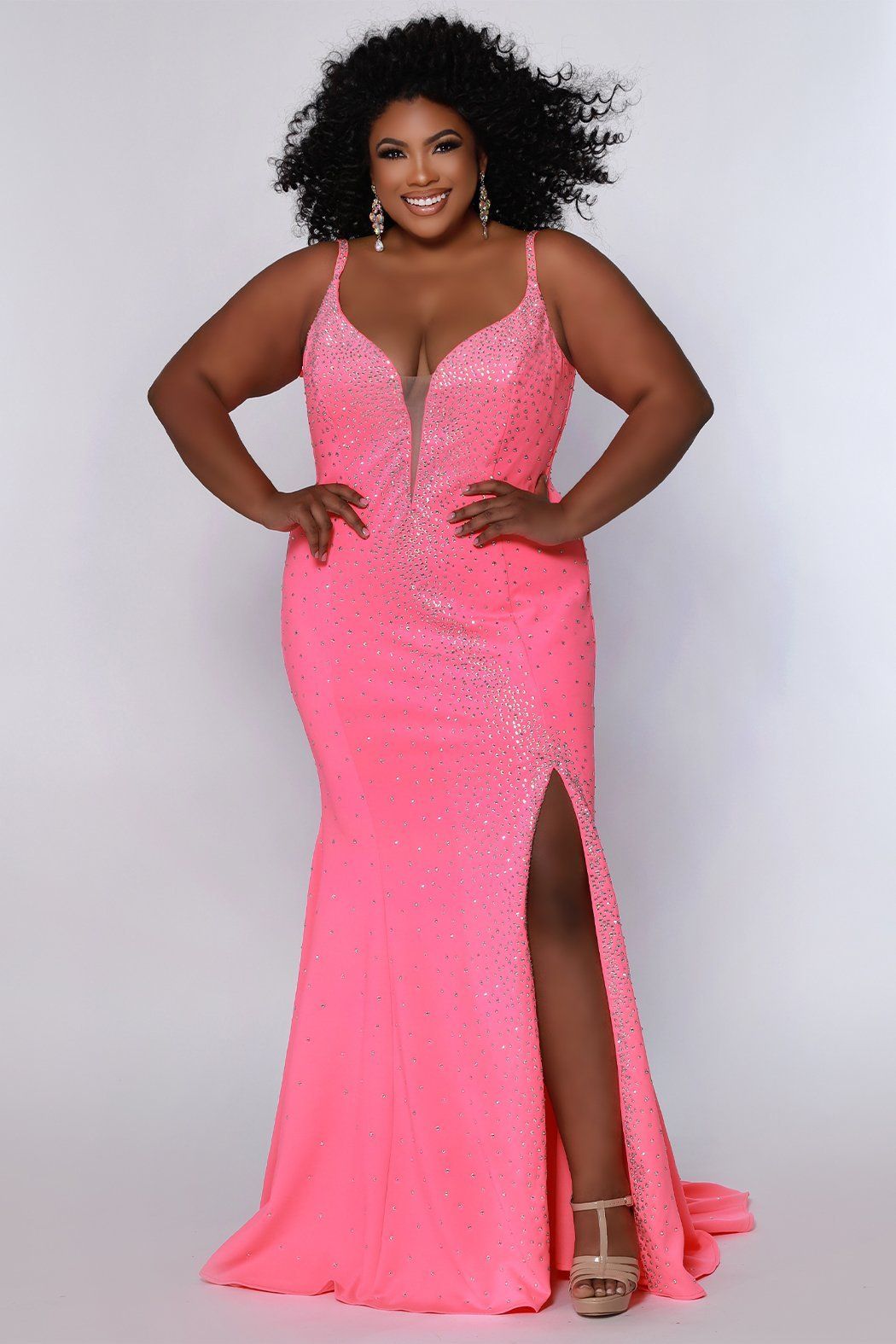 Johnathan Kayne for Sydney's Closet princess line slim silhouette with deep v neckline all over ab hotfix stones and center back zipper available in deep red, hot coral and white ice Maverick Pageant Gown JK2218