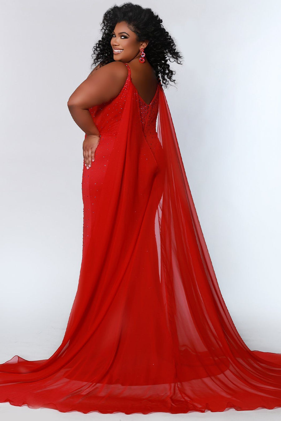 Johnathan Kayne for Sydney's Closet princess line slim silhouette with deep v neckline all over ab hotfix stones and center back zipper available in deep red, hot coral and white ice Maverick Pageant Gown JK2218