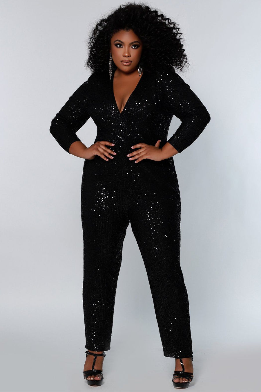 Johnathan Kayne for Sydney's Closet jumpsuit with v neckline and detatchable charmeuse overskirt and long sleeves made of stretch sequin fabric available in firecracker and jet Matador Pageant Jumpsuit JK2220