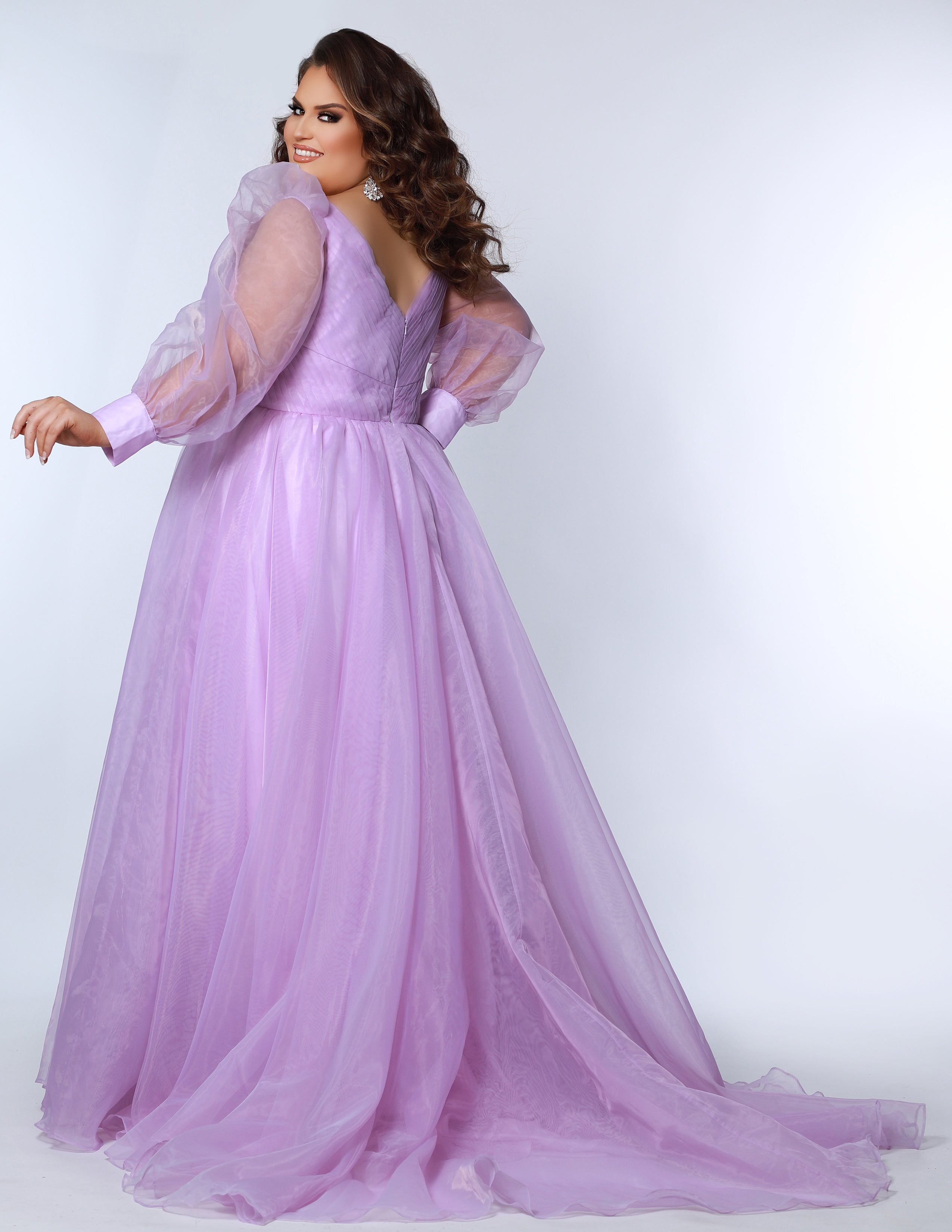JK2317 plus size organza evening gown.  V-neckline, puff sleeves with cuff, pleated organza bodice and sweep train. Available in lilac purple, sky blue and diamond white. Johnathan Kayne for Sydney's Closet.