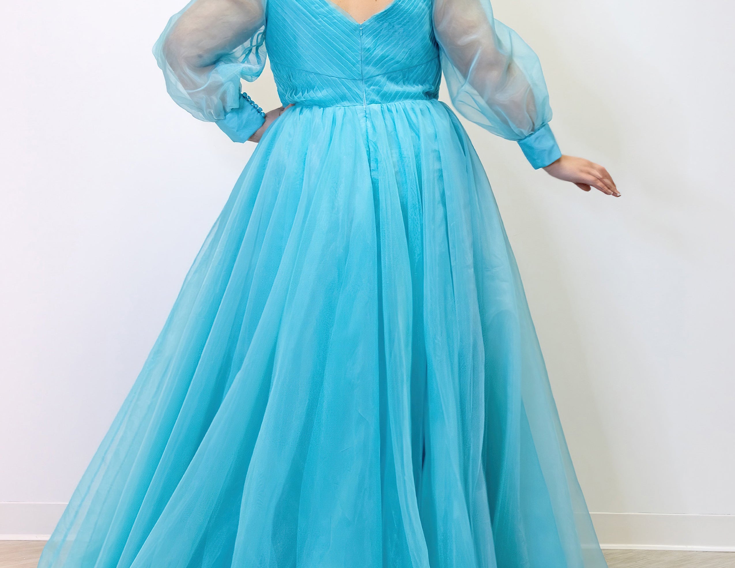 JK2317 plus size organza evening gown.  V-neckline, puff sleeves with cuff, pleated organza bodice and sweep train. Available in lilac purple, sky blue and diamond white. Johnathan Kayne for Sydney's Closet.