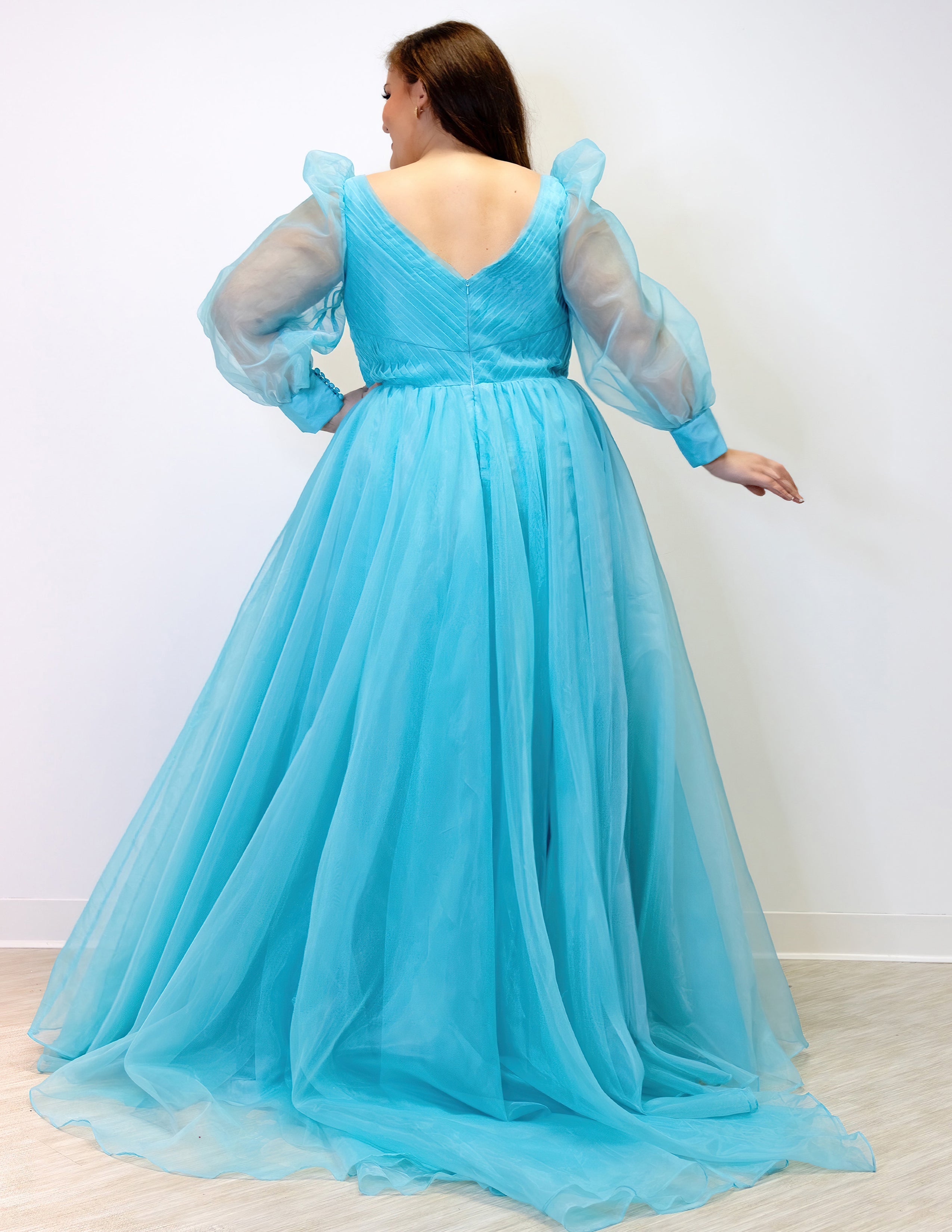 JK2317 plus size organza evening gown.  V-neckline, puff sleeves with cuff, pleated organza bodice and sweep train. Available in lilac purple, sky blue and diamond white. Johnathan Kayne for Sydney's Closet.