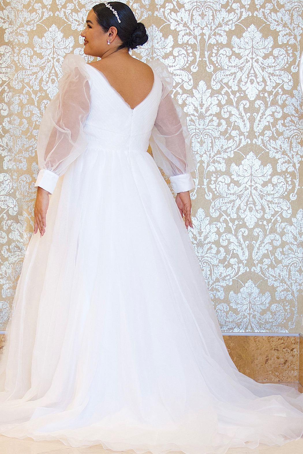 JK2317 plus size organza wedding gown.  V-neckline, puff sleeves with cuff, pleated organza bodice and sweep train. Available in lilac purple, sky blue and diamond white. Johnathan Kayne for Sydney's Closet.