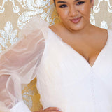 JK2317 plus size organza wedding gown.  V-neckline, puff sleeves with cuff, pleated organza bodice and sweep train. Available in lilac purple, sky blue and diamond white. Johnathan Kayne for Sydney's Closet.