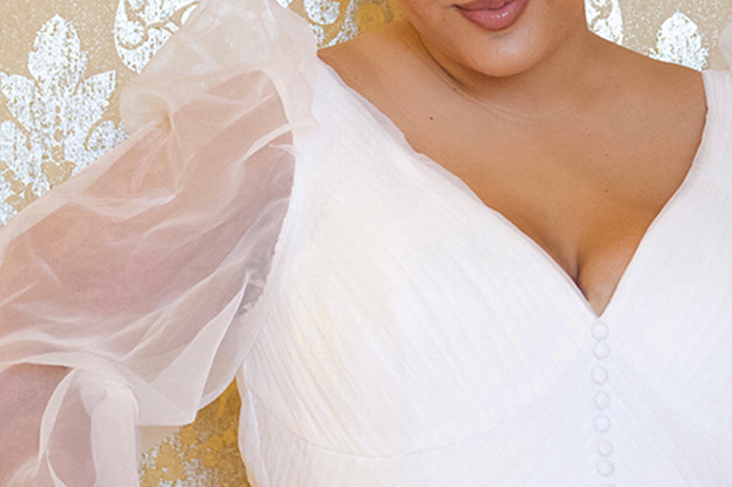 JK2317 plus size organza wedding gown.  V-neckline, puff sleeves with cuff, pleated organza bodice and sweep train. Available in lilac purple, sky blue and diamond white. Johnathan Kayne for Sydney's Closet.