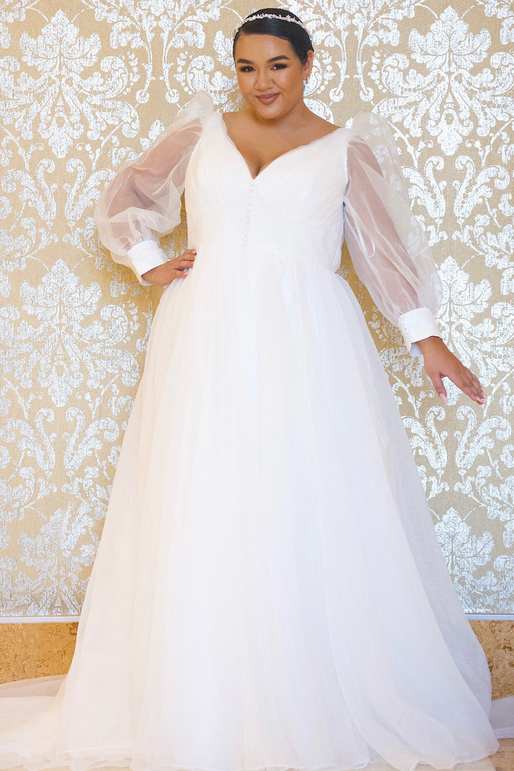 JK2317 plus size organza wedding gown.  V-neckline, puff sleeves with cuff, pleated organza bodice and sweep train. Available in lilac purple, sky blue and diamond white. Johnathan Kayne for Sydney's Closet.