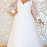 JK2317 plus size organza wedding gown.  V-neckline, puff sleeves with cuff, pleated organza bodice and sweep train. Available in lilac purple, sky blue and diamond white. Johnathan Kayne for Sydney's Closet.