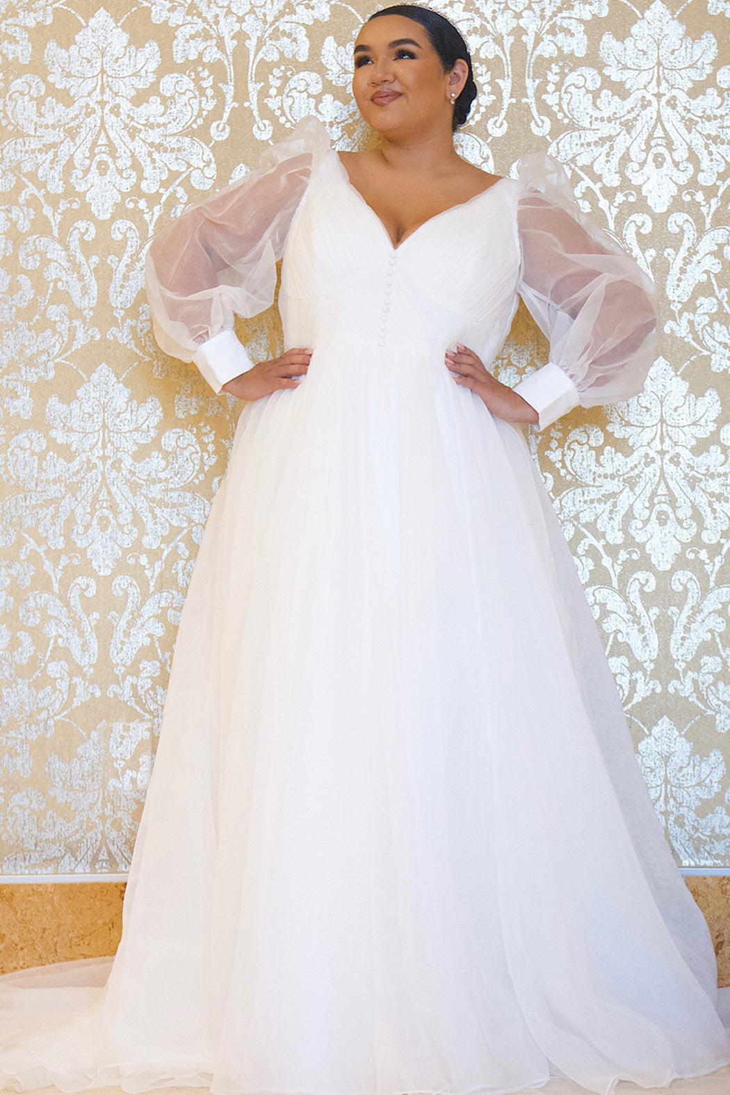 JK2317 plus size organza wedding gown.  V-neckline, puff sleeves with cuff, pleated organza bodice and sweep train. Available in lilac purple, sky blue and diamond white. Johnathan Kayne for Sydney's Closet.
