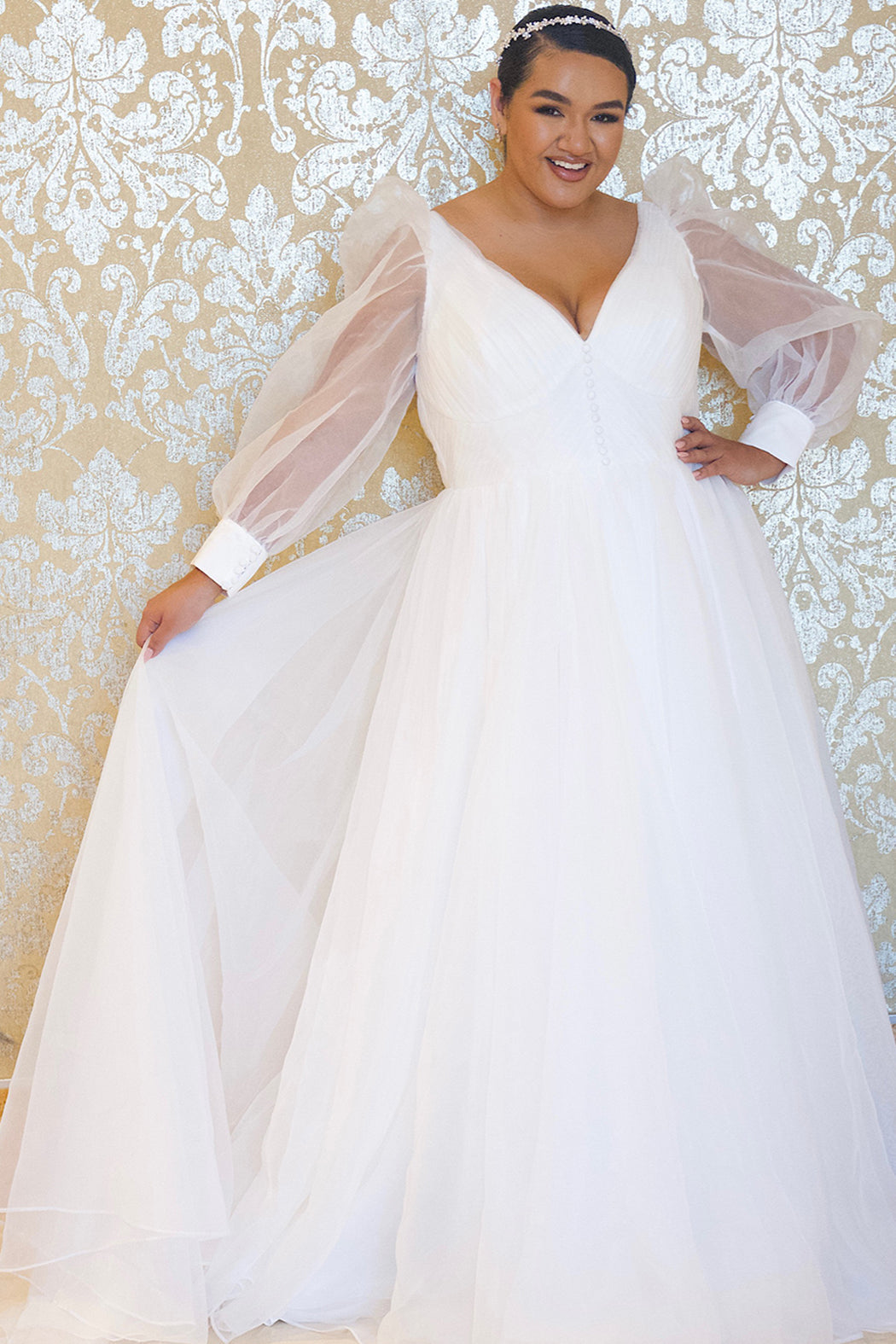 JK2317 plus size organza wedding gown.  V-neckline, puff sleeves with cuff, pleated organza bodice and sweep train. Available in lilac purple, sky blue and diamond white. Johnathan Kayne for Sydney's Closet.