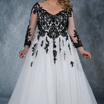 MB2010 plus size bridal gown with deep V-neckline and illusion mesh sleeves are embellished with intricate lace appliques. Full ball gown tulle skirt and lace-up back with modesty panel.