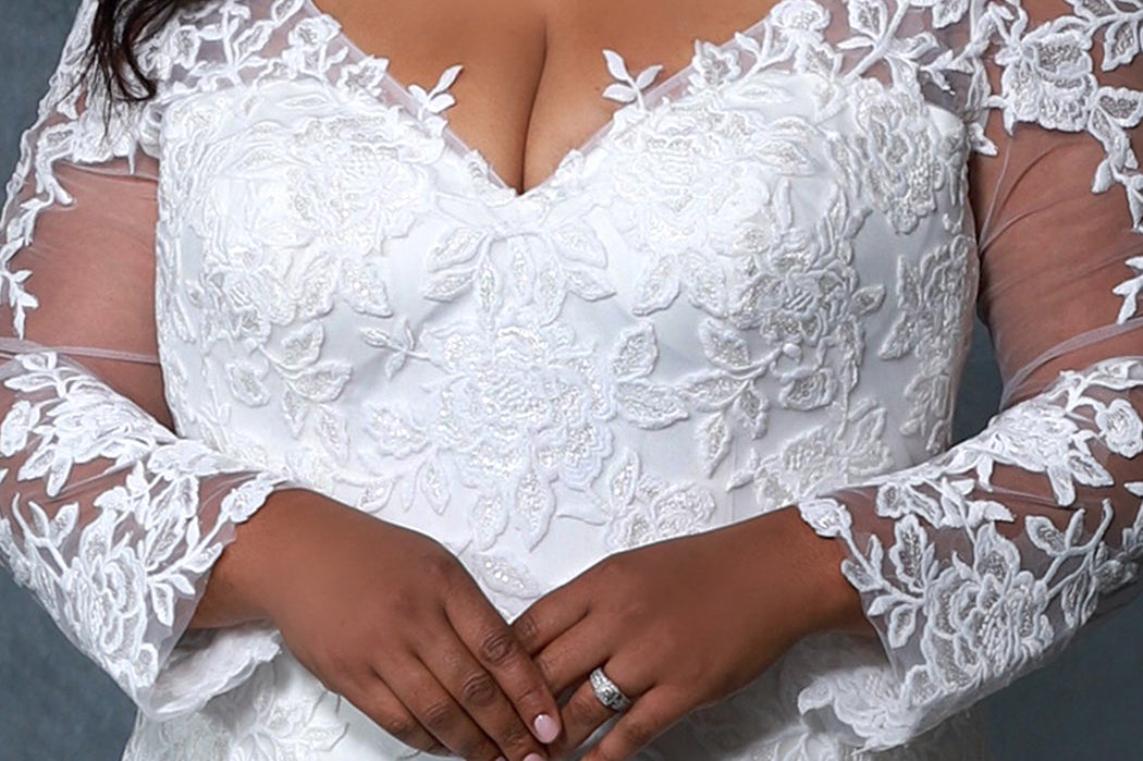 Michelle Bridal MB2202 Up close shot of bodice Plus Size ivory v-neck mermaid wedding dress with lace details on body and sleeves 