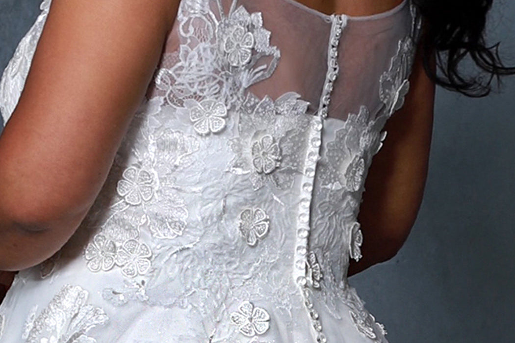 Michelle Bridal MB2206 Up Close shot of back detailing with floral lace, crystal buttons, and a high mesh scoop back. 