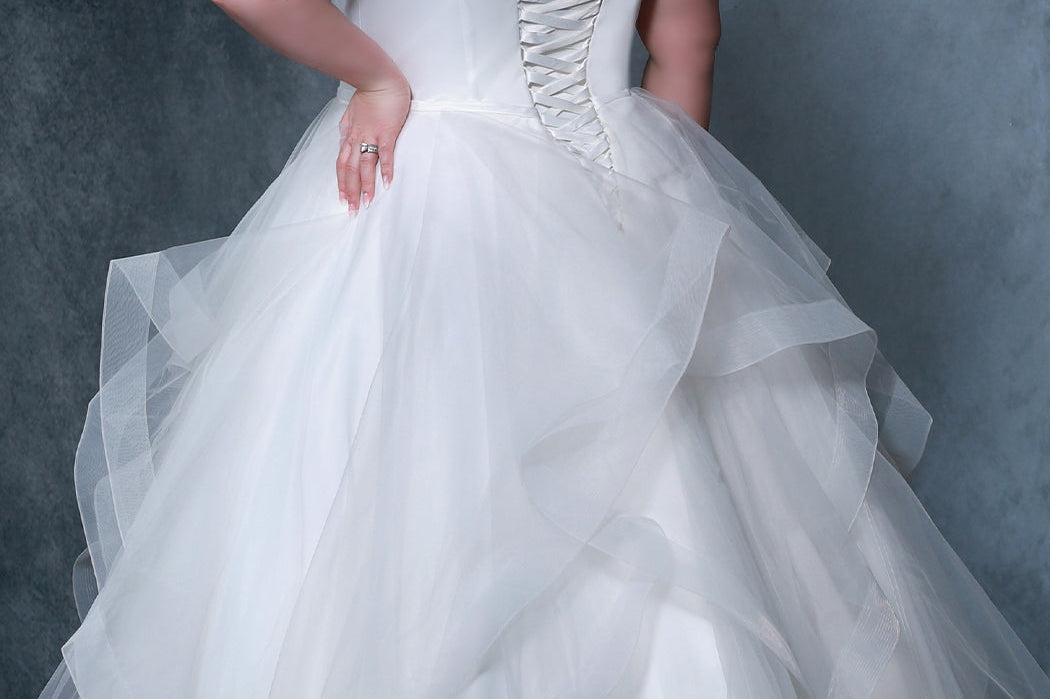 Michelle Bridal MB2207 Back view plus size bridal dress with satin bodice, lace up corset back, and layered tulle skirt. 
