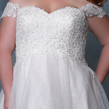 Michelle Bridal MB2211 close up on plus size ballgown in ivory champagne with sweetheart neckline, lace bodice, and lace detachable off the shoulder straps. 