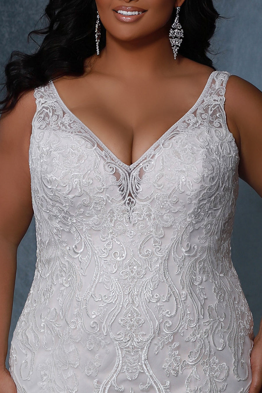 Michelle Bridal MB2212 Close up of lace detail and v-neckline. 