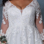 Michelle Bridal BB2213 Close up of Ivory/Ivory Plus size A-line wedding dress with mesh and lace long sleeves, v-neckline, and lace bodice.