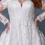 Michelle Bridal BB2213 Close up of Pink Champagne Nude Plus size A-line wedding dress with mesh and lace long sleeves, v-neckline, and lace bodice.