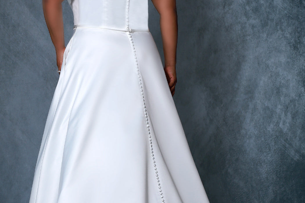 Michelle Bridal by Sydney's Closet MB2217 aline silhouette with off the shoulder straps and 13 bones in bodice this dress features 120 satin covered buttons on the back of train with a center back zipper and pockets available in black ivory and white