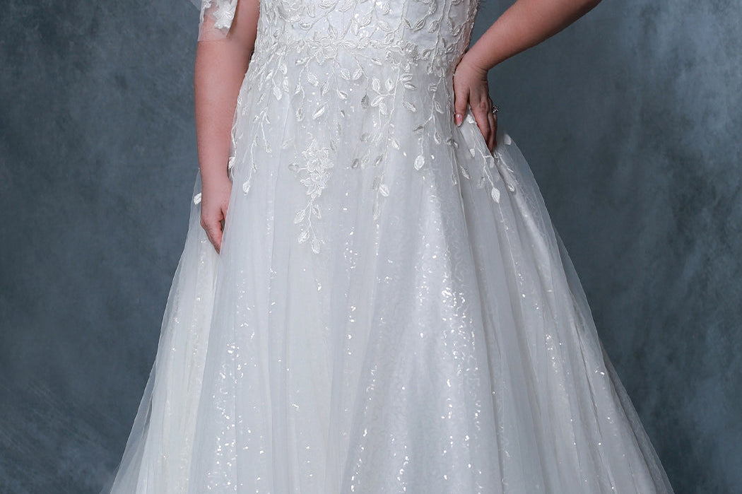 Michelle Bridal by Sydney's Closet MB2218 v neckline aline silhouette with 8 bones in bodice and spaghetti straps with beading and off the shoulder flutter sleeve with elastic band dress also features soft bridal tulle and sparkle tulle and invisible center back zipper available in ivory