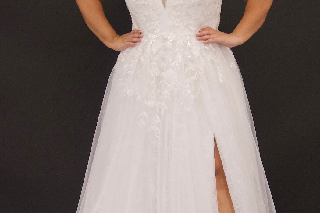 Plus size sexy bridal gown with sparkle tulle, high slit and drape sleeves. Michelle Bridal MB2315 in ivory