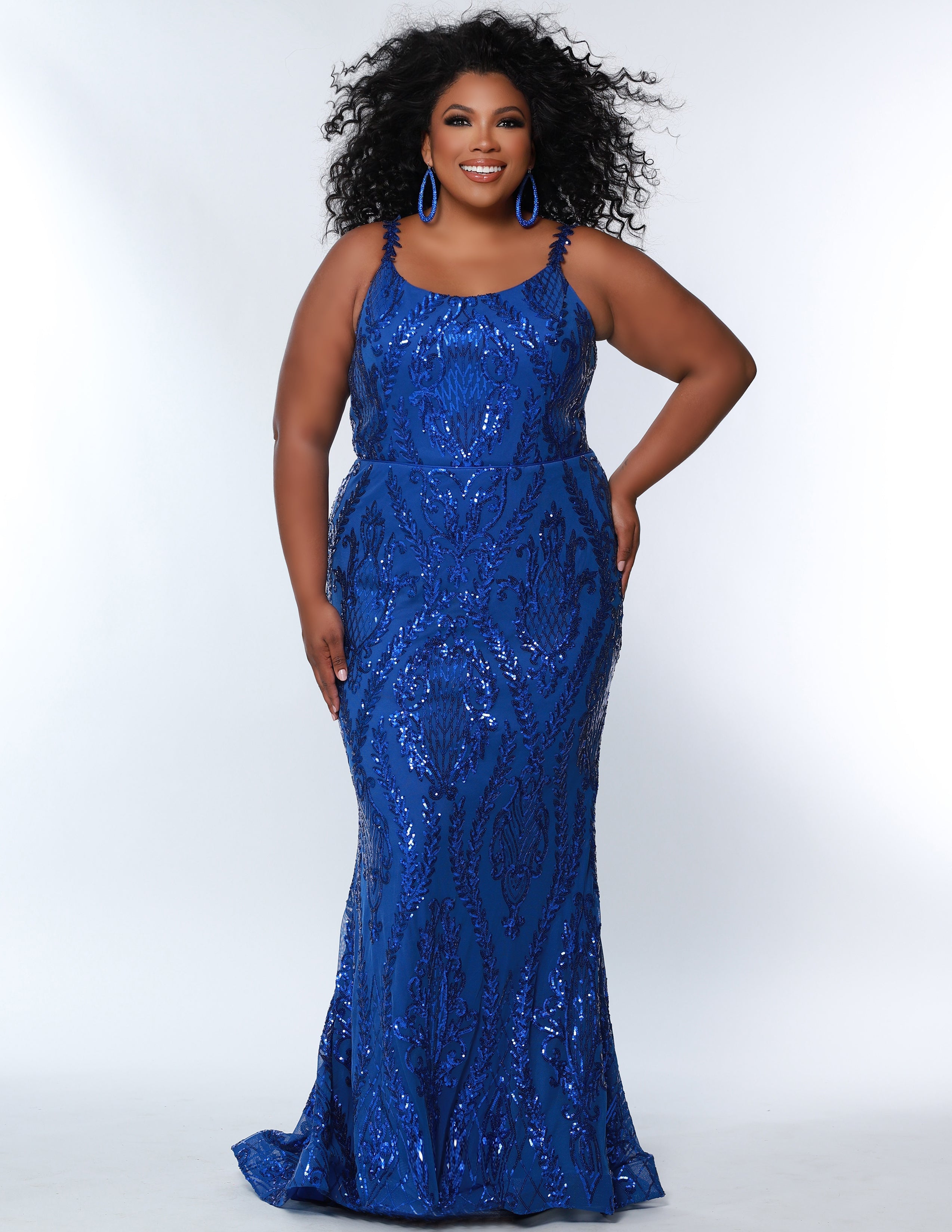 Sydney's Prom by Sydney's Closet slim aline silhouette with scoop neckline and scoop back center back zipper and sequins over stretch knit with 5 inch train available in royal blue SC7332