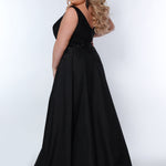Sydney’s Closet SC7341 Black.  Slim/Fitted silhouette, deep V-neckline and bra-friendly straps. Natural waistline, sequins on net. Mid-thigh skirt with attached charmeuse overskirt. Center  back zipper. 