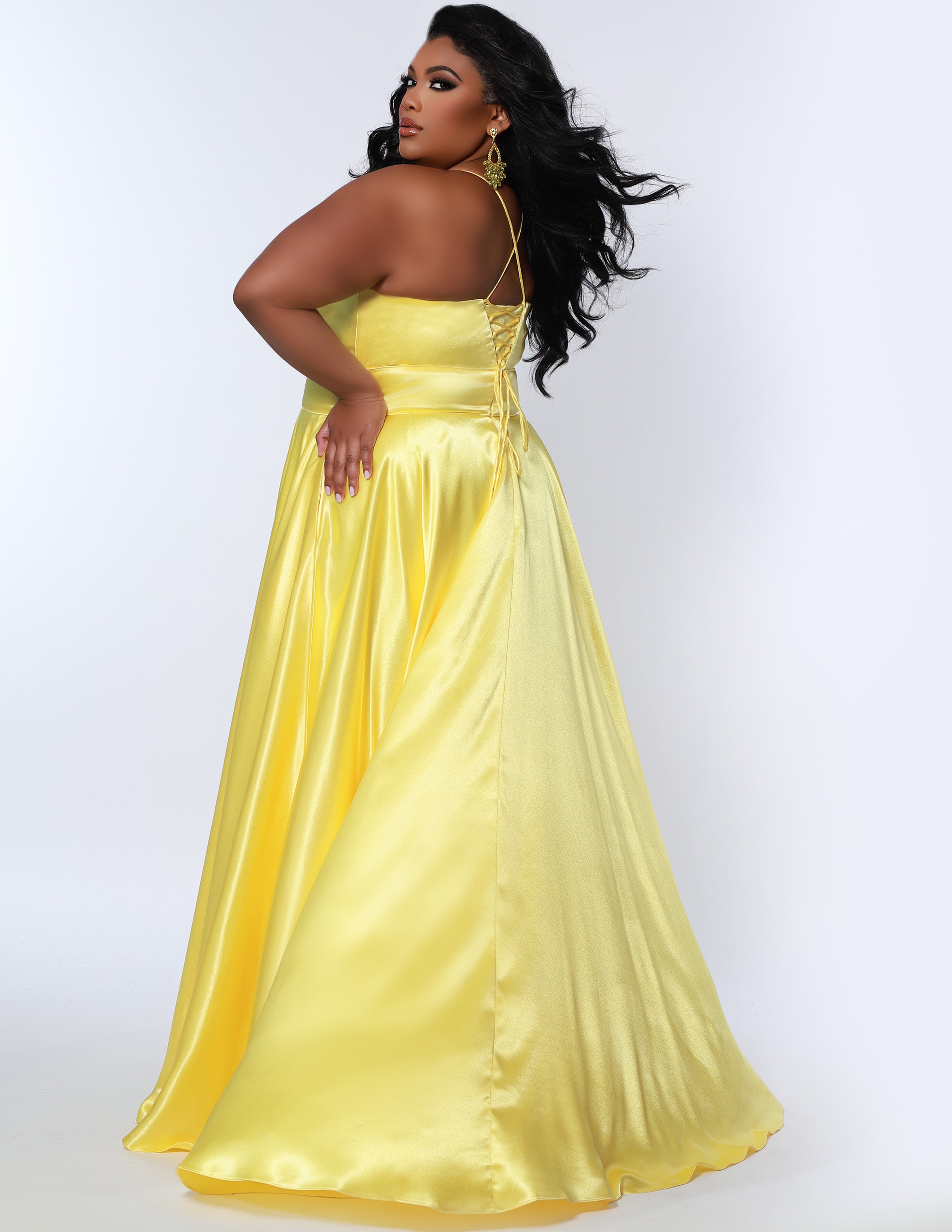 Sydney’s Closet SC7355 in lemon yellow. Full A-line silhouette with a Sweetheart neckline and spaghetti straps. Has a lace up back, modesty panel and fully lined skirt with pockets and a slit. Offered in apricot orange, lemon yellow, lime green and raspberry pink.