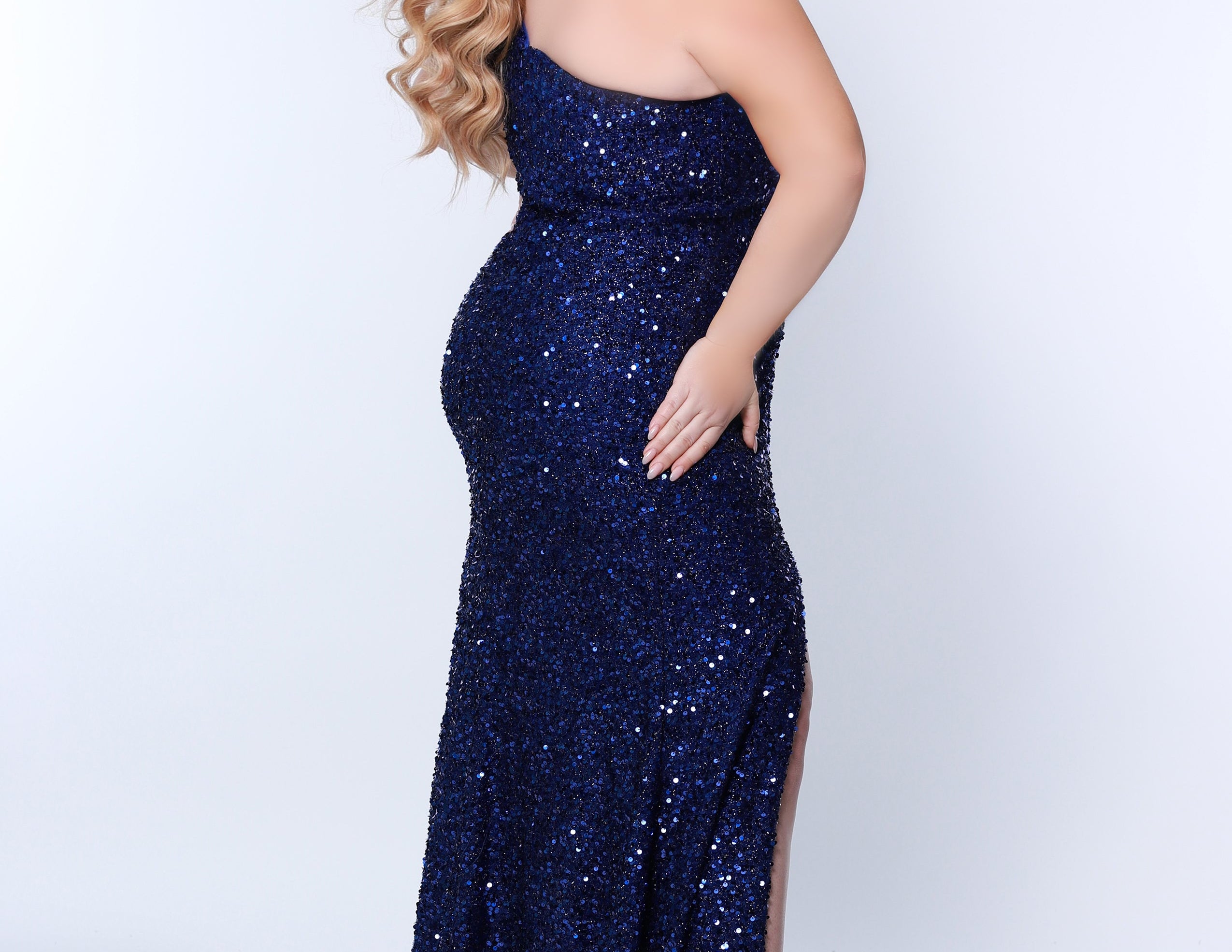 SC7360 one-shoulder plus size prom and evening gown with slit from Sydney's Closet available in red, black, sapphire blue or purple