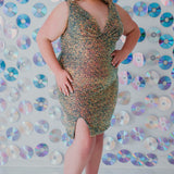This is SC8110 in our Sydney's Closet Homecoming collection. This plus size party dress comes in blue, red, and green! This dress has bra friendly straps, empire waistline, and a v-neckline. This fitted all over sequin dress has a small slit above the right knee! This gown will catch the light for this homecoming season!