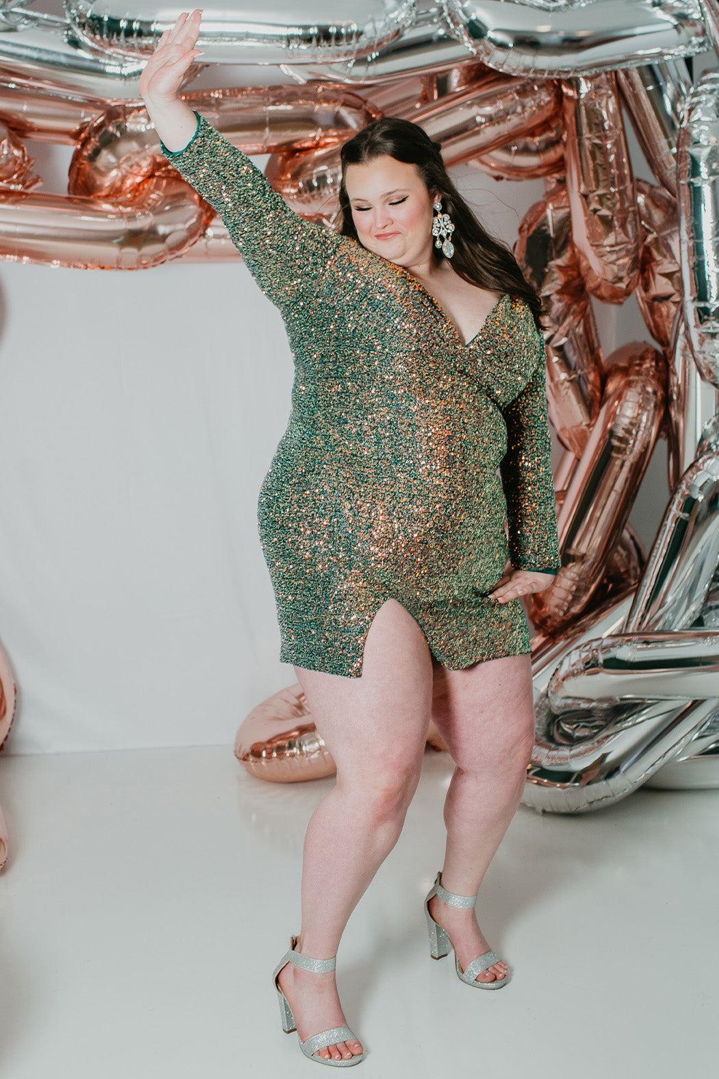Sydney's CLoset SC8111 short plus size part y  dress with deep V-neckline, long sleeves and high slit. Multi dimensional sequins and ruched bodice. 