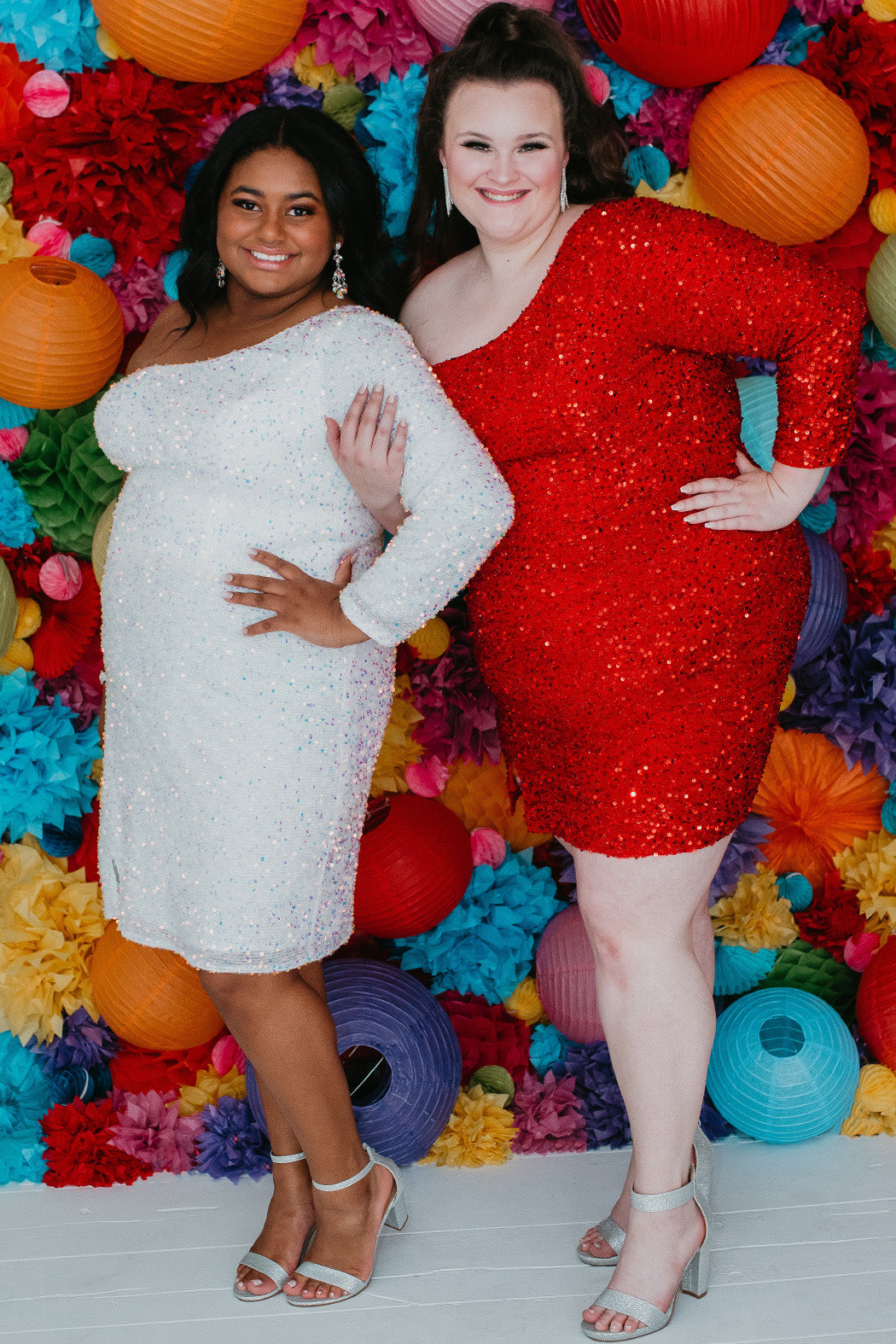 This is SC8112 in our Sydney's Closet Homecoming collection. This plus size party dress comes in green, black, white, red, and blue! This dress has one shoulder long sleeve, natural waistline, and a scoop neckline. This fitted all over sequin dress has a small slit above the right knee! This gown is set in stone for this homecoming season!