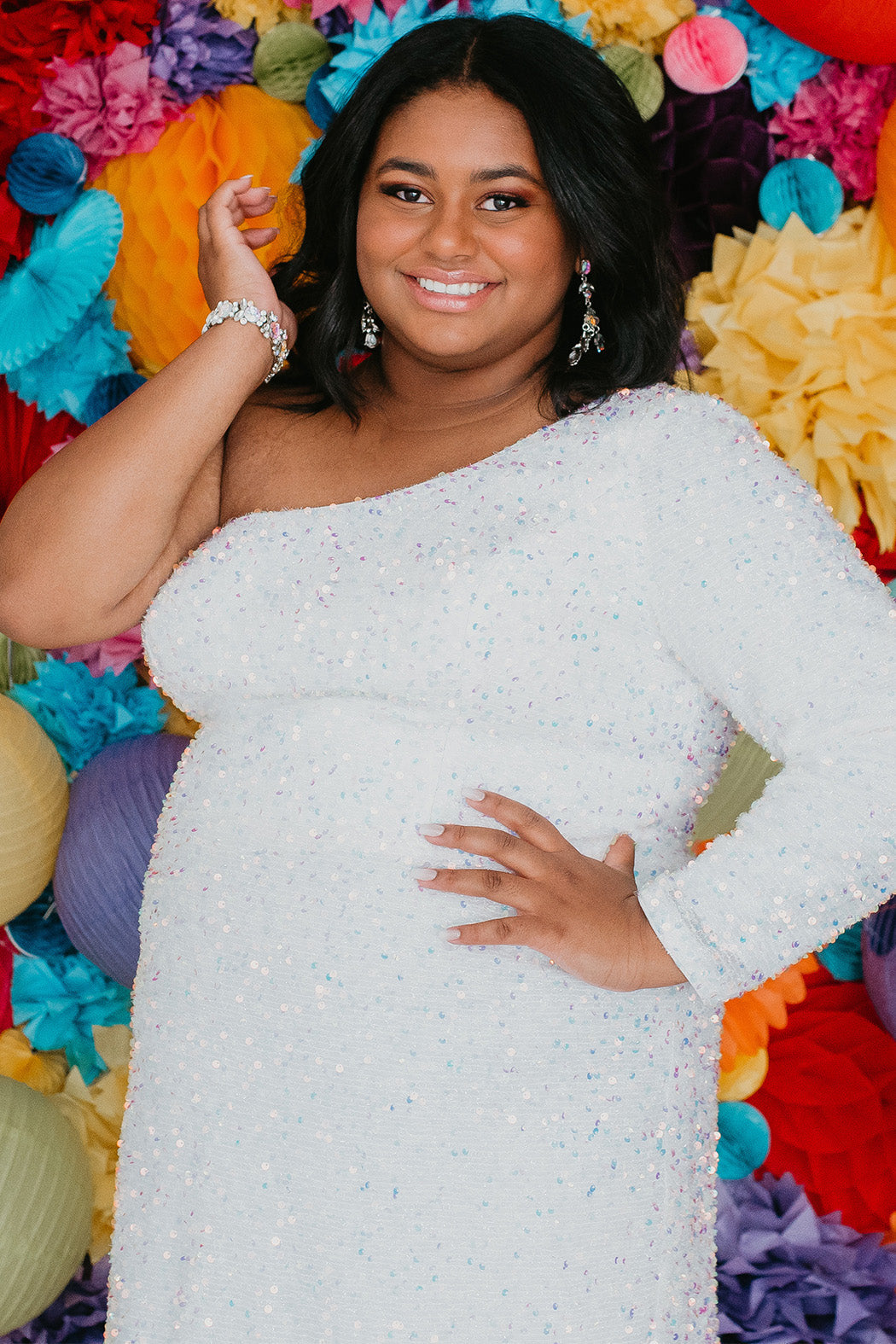 This is SC8112 in our Sydney's Closet Homecoming collection. This plus size party dress comes in green, black, white, red, and blue! This dress has one shoulder long sleeve, natural waistline, and a scoop neckline. This fitted all over sequin dress has a small slit above the right knee! This gown is set in stone for this homecoming season!