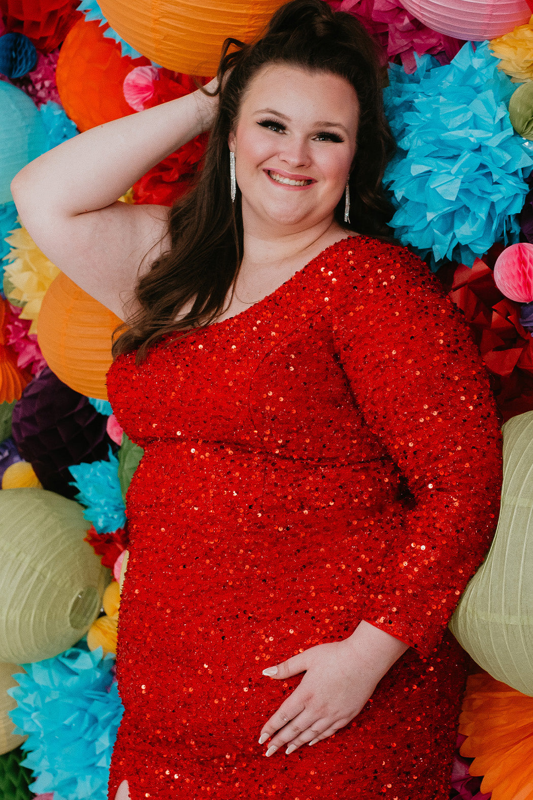 This is SC8112 in our Sydney's Closet Homecoming collection. This plus size party dress comes in green, black, white, red, and blue! This dress has one shoulder long sleeve, natural waistline, and a scoop neckline. This fitted all over sequin dress has a small slit above the right knee! This gown is set in stone for this homecoming season!